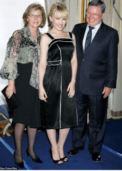 Carol, with her husband and daughter, Kylie